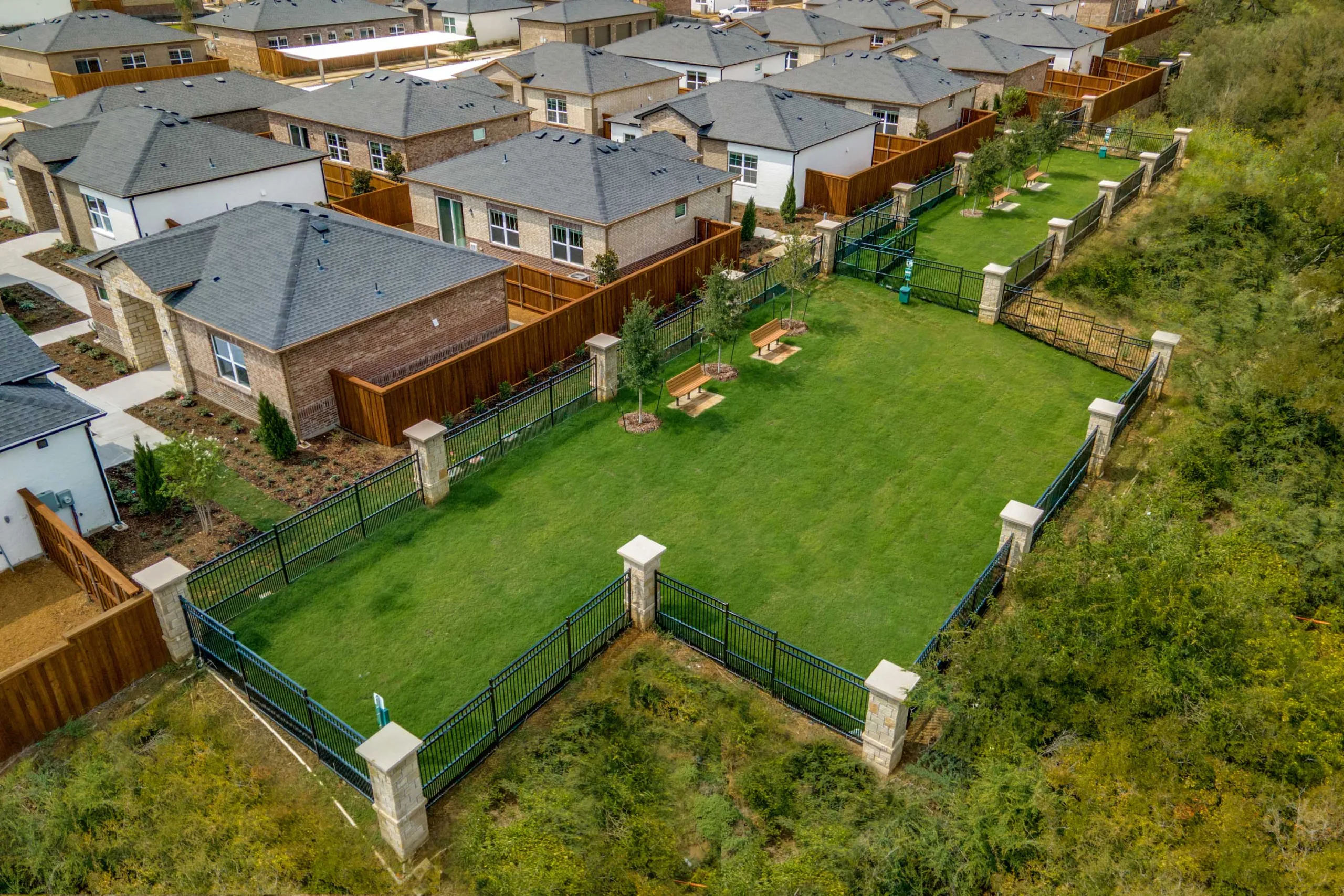 Arial view of dog park in a brand-new rental home at Yardly Elm in Denton, Texas.